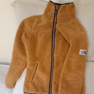 This is North Face Fleece Jacket.   Size XS.  beautiful golden camel color